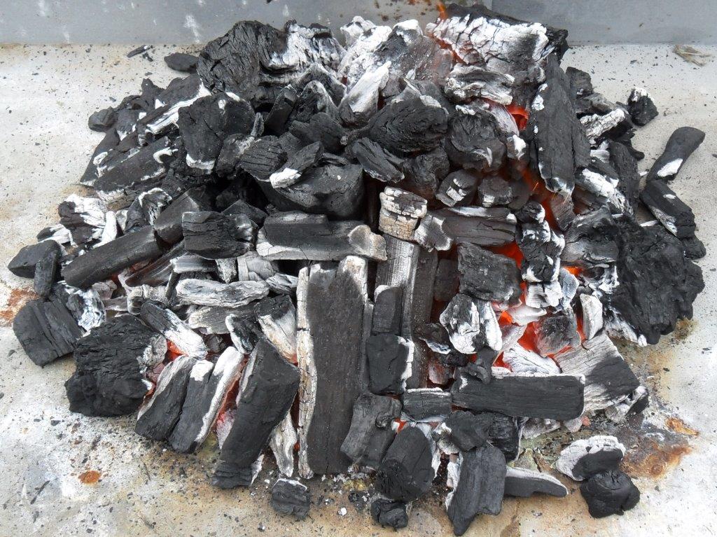 This picture shows charcoal being lit with firelighters